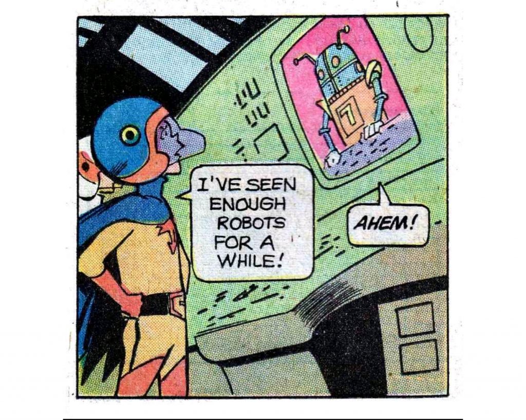 A panel from a Gold Key comic based on the TV series 'Battle Of The Planets'. Keyops, a visor and cool-cloak'd hero is asking to a robot on a screen saying "I've seen enough robots for a while". The robot responds with an 'ahem'
